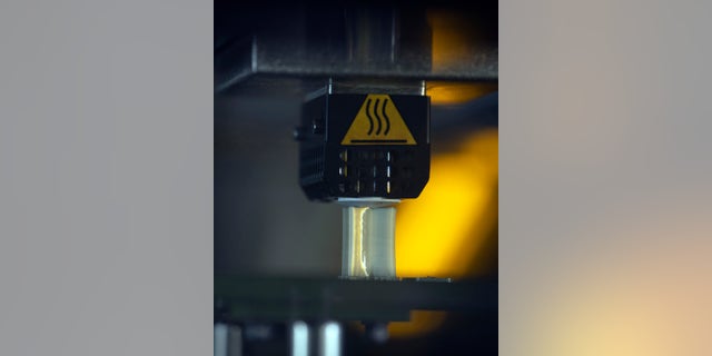 An aircraft part prints on the Stratasys F900 three-dimensional printer Aug. 15, 2019, at Travis Air Force Base, California.