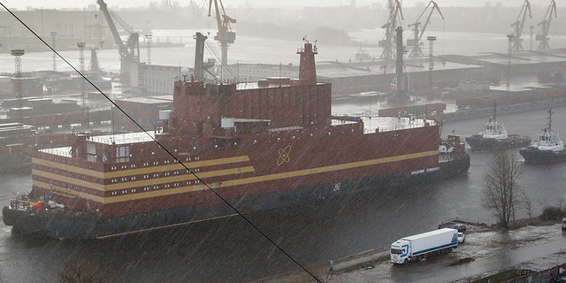 The floating nuclear power plant Akademik Lomonosov is towed out of the shipyard where it was constructed in St. Petersburg, Russia, in April 2018. (AP)