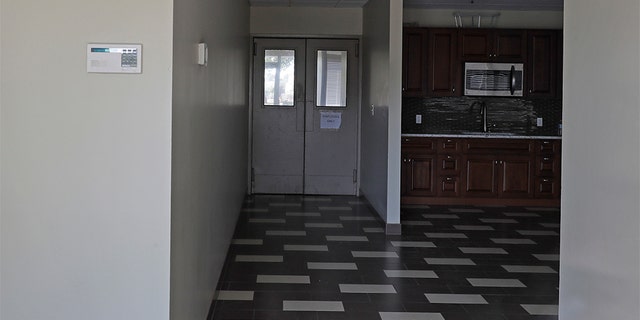 In this Wednesday, July 31, 2019, photo a building that used to house office and storage space for a pawn shop alleged to have been a front for a theft ring stands empty in Kent, Wash.