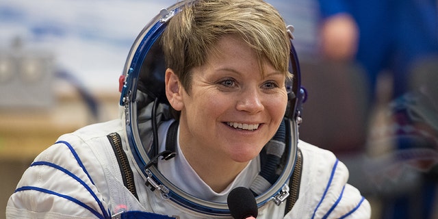 Expedition 58 Flight Engineer Anne McClain of NASA speaks with friends and family after having her Russian Sokol suit pressure checked in preparation for her launch aboard the Soyuz MS-11 spacecraft on Monday, Dec. 3, 2018, at the Baikonur Cosmodrome in Kazakhstan. (NASA/Aubrey Gemignani)