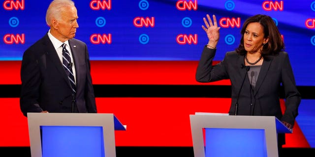 Sen. Kamala Harris, D-Calif., speaks as former Vice President Joe Biden listens during the second of two Democratic presidential primary debates hosted by CNN Wednesday, July 31, 2019, in the Fox Theatre in Detroit. (AP Photo/Paul Sancya)