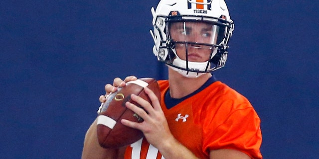 FILE - In this Friday, Aug. 2, 2019 file photo, Auburn quarterback Bo Nix throws a pass during Auburn's first practice in Auburn, Ala. Freshman Bo Nix will be Auburn’s starting quarterback in the season opener against Oregon. Auburn announced coach Gus Malzahn’s decision on Twitter, officially ending a battle with redshirt freshman Joey Gatewood, Tuesday, Aug. 20, 2019. (AP Photo/Butch Dill)