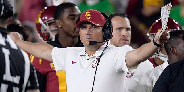 FILE - In this Nov. 24, 2018, file photo, Southern California head coach Clay Helton gestures during the first half of an NCAA college football game against Notre Dame in Los Angeles. Helton went 21-6 with a Rose Bowl victory and Pac-12 title in his first two full seasons as USC coach, but his job status is one of the stories of the 2019 season. (AP Photo/Mark J. Terrill, File)