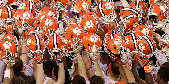 In this Jan. 7, 2019, file photo, Clemson players huddle before the NCAA college football playoff championship game against Alabama, in Santa Clara, Calif. (AP Photo/Jeff Chiu, File)