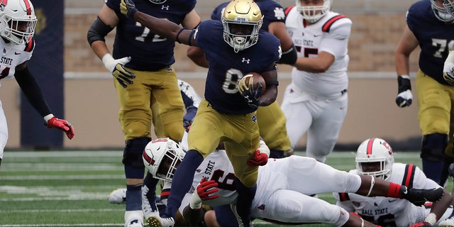 FILE - In this Sept. 8, 2018, file photo, Notre Dame wide receiver/running back Jafar Armstrong (8) runs with the ball against Ball State during the first half of an NCAA college football game in South Bend, Ind. There is no Dexter Williams in the backfield this season for No. 9 Notre Dame. Instead, the Fighting Irish will look to a stable of running backs to pick up the slack, including Tony Jones and converted wide receiver Jafar Armstrong. (AP Photo/Nam Y. Huh, File)