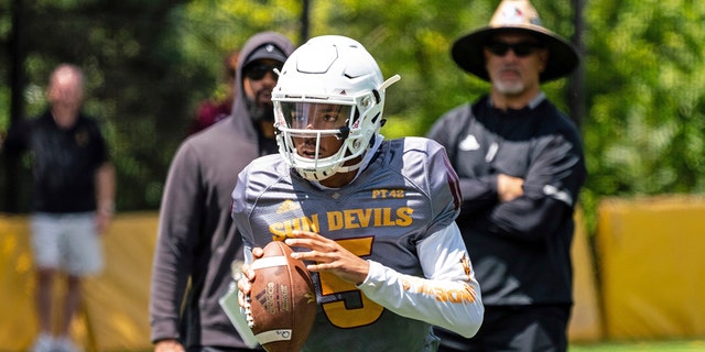 This Aug. 8, 2019, photo provided by Sun Devil Athletics shows Arizona State University freshman quarterback Jayden Daniels at practice in Payson, Ariz. Daniels will become the first Arizona State true freshman quarterback to start a season opener for the Sun Devils, as he won a four-man competition for the job. (Radmen Niven/Sun Devil Athletics via AP)