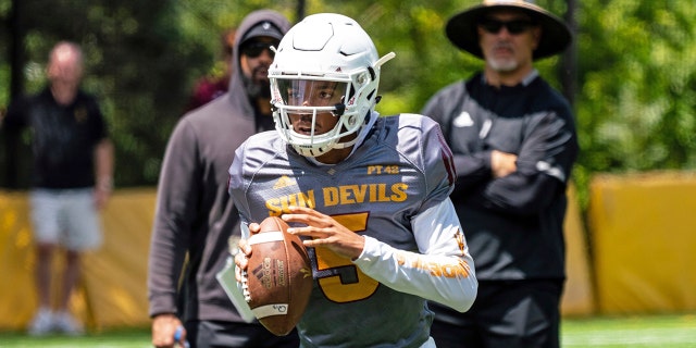 This Aug. 8, 2019, photo provided by Sun Devil Athletics shows Arizona State University freshman quarterback Jayden Daniels at practice in Payson, Ariz. Daniels will become the first Arizona State true freshman quarterback to start a season opener for the Sun Devils, as he won a four-man competition for the job. (Radmen Niven/Sun Devil Athletics via AP)