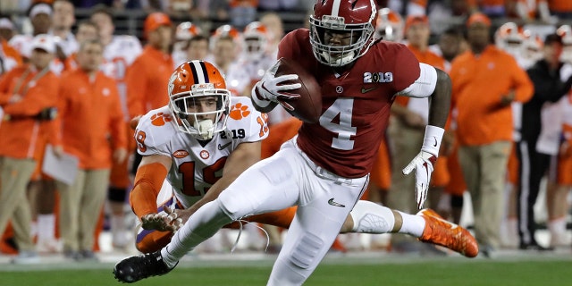 FILE - In this Jan. 7, 2019, file photo, Alabama's Jerry Jeudy catches a touchdown pass in front of Clemson's Tanner Muse during the first half the NCAA college football playoff championship game in Santa Clara, Calif. (AP Photo/Chris Carlson, File)
