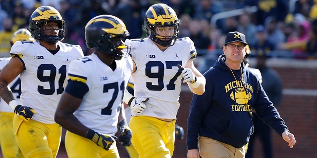 Jim Harbaugh seems to be set up for success at Michigan in his fifth season, leading a program that is a popular choice to win the Big Ten. "That's where I would pick us," Harbaugh said. Some are predicting the Wolverines will earn a spot in the College Football Playoff to give them a chance to win a national championship for the first time since 1997. (AP Photo/Carlos Osorio, File)