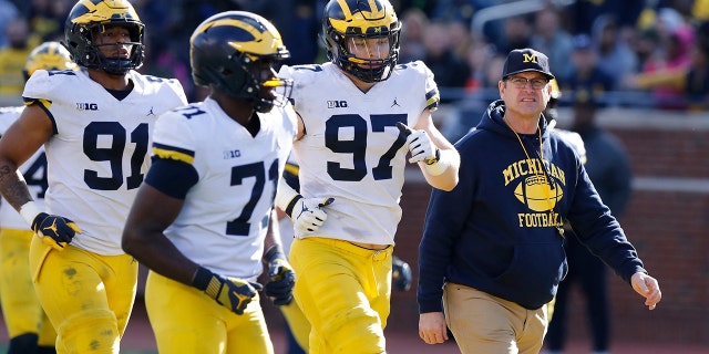 Jim Harbaugh seems to be set up for success at Michigan in his fifth season, leading a program that is a popular choice to win the Big Ten. "That's where I would pick us," Harbaugh said. Some are predicting the Wolverines will earn a spot in the College Football Playoff to give them a chance to win a national championship for the first time since 1997. (AP Photo/Carlos Osorio, File)