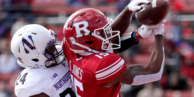FILE - In this Oct. 20, 2018 file photo, Northwestern cornerback Montre Hartage, left, deflects a pass as Rutgers wide receiver Shameen Jones tries to make the catch in the end zone during the second half of an NCAA college football game in Piscataway, N.J. New Jersey's flagship university has asked a high school in northern Louisiana to change its logo because it's identical to the block "R'' that Rutgers has trademarked. (AP Photo/Julio Cortez, File)
