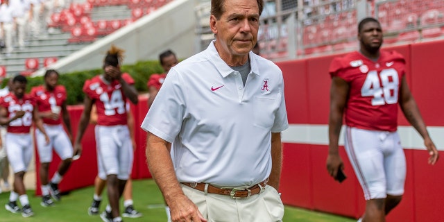 FILE - In this Aug. 3, 2019, file photo, Alabama head coach Nick Saban leaves the field after a team photo prior to Alabama's fall camp fan-day college football scrimmage, in Tuscaloosa, Ala. Alabama is hardly immune to change, with an assemblage of new assistant coaches and the next wave of blue-chip prospects replacing the old ones. Two constants remain: coach Nick Saban and championship expectations. (AP Photo/Vasha Hunt)
