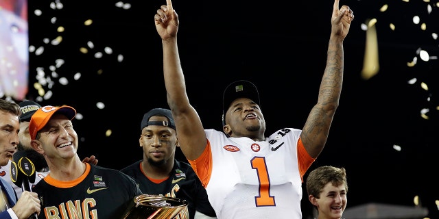 FILE - In this Jan. 7, 2019, file photo, Clemson's Trayvon Mullen celebrates after the NCAA college football playoff championship game against Alabama, in Santa Clara, Calif. For the first time, the defending national champion Tigers are No. 1 in The Associated Press preseason Top 25 presented by Regions Bank, Monday, Aug. 19, 2019. (AP Photo/David J. Phillip, File)