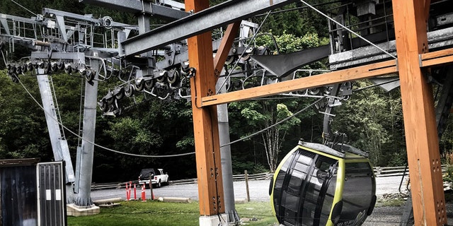 A gondola car can be seen on the ground after someone apparently cut a cable at the Sea to Sky Gondola in British Columbia early Saturday, according to police.