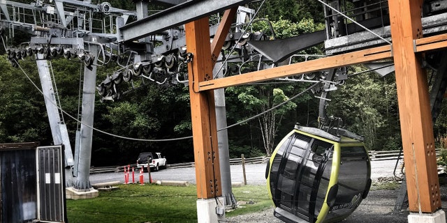 A gondola car can be seen on the ground after someone apparently cut a cable at the Sea to Sky Gondola in British Columbia early Saturday, according to police.