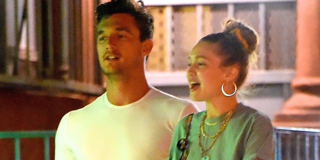Tyler Cameron (L) with Gigi Hadid (R) in New York City.