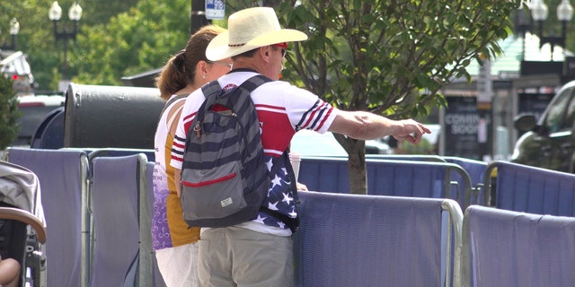 Carlos Arredondo and his wife Malida inspect the work underway on the memorial near the finish line.