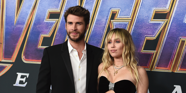 FILE - In this Monday, April 22, 2019, file photo, Liam Hemsworth and Miley Cyrus arrive at the premiere of "Avengers: Endgame" at the Los Angeles Convention Center.