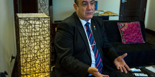 Guatemala's President-elect Alejandro Giammattei gives an interview in Guatemala City, Tuesday, Aug. 13, 2019. Giammattei said Tuesday that Guatemala will not be able to hold up its side of an immigration agreement with the United States by serving as a "safe third country" for asylum seekers. (AP Photo/Oliver de Ros)