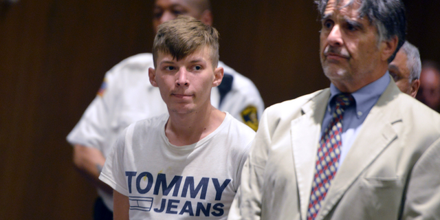 Volodymyr Zhukovskyy, 23, of West Springfield, the driver of a pickup truck in a fiery collision on a highway in rural Randolph, N.H., that killed seven motorcyclists, stands with his attorney Donald Frank during a hearing in Springfield District Court in Springfield, Mass., June 24, 2019. (Associated Press)