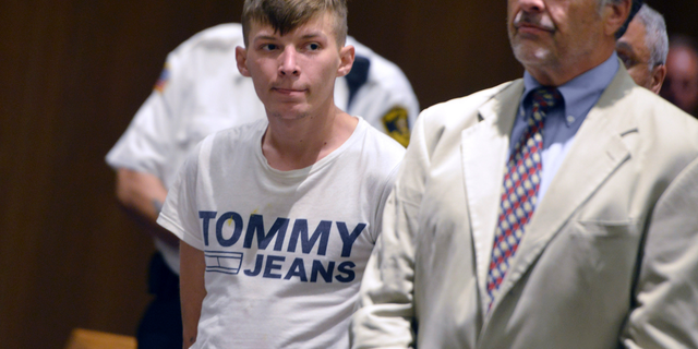 Volodymyr Zhukovskyy, 23, of West Springfield, the driver of a pickup truck in a fiery collision on a highway in rural Randolph, N.H., that killed seven motorcyclists, stands with his attorney Donald Frank during a hearing in Springfield District Court in Springfield, Mass., June 24, 2019. (Associated Press)