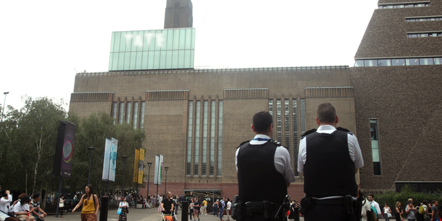 Emergency crews attending a scene at the Tate Modern art gallery, London, Sunday, Aug. 4, 2019.