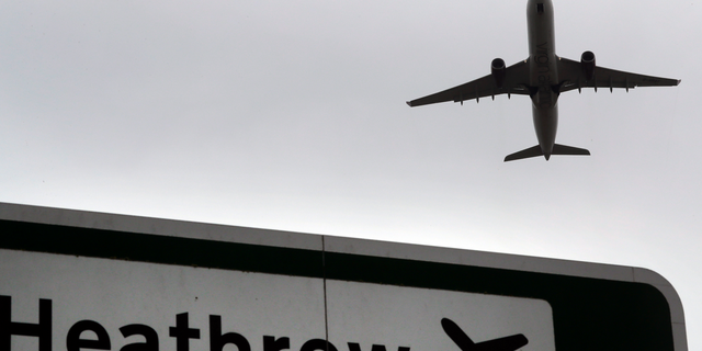 FILE - Sign outside Heathrow Airport in London, UK.