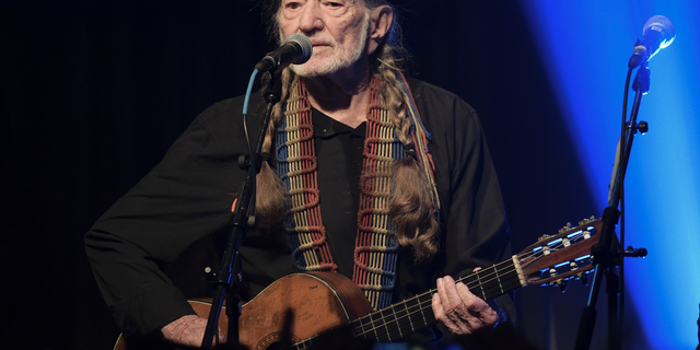 In this Feb. 6, 2019 file photo, Willie Nelson performs at the Producers &amp; Engineers Wing 12th Annual GRAMMY Week Celebration at the Village Studio in Los Angeles.
