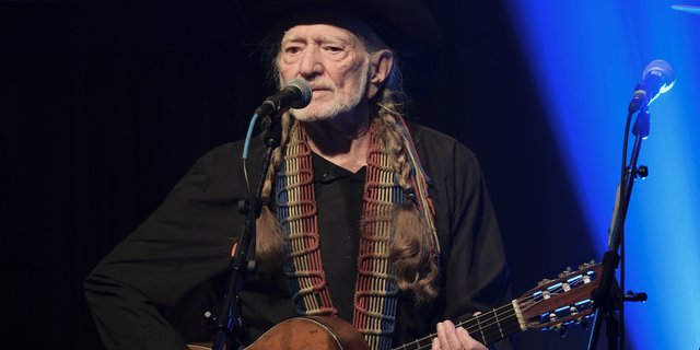 In this Feb. 6, 2019 file photo, Willie Nelson performs at the Producers &amp; Engineers Wing 12th Annual GRAMMY Week Celebration at the Village Studio in Los Angeles.