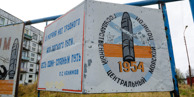 This photo taken on Oct. 7, 2018, shows a billboard that reads "The State Central Navy Testing Range" near residential buildings in the village of Nyonoksa, northwestern Russia.