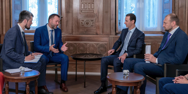 In this photo released by the Syrian official news agency SANA, Syrian President Bashar Assad, second right, meets with a Russian delegation in Damascus, Syria, Tuesday, Aug. 20, 2019. Assad said his forces' recent victories in the northwestern province of Idlib "show the determination of the people and the army to strike terrorists, until all parts of Syria are liberated."