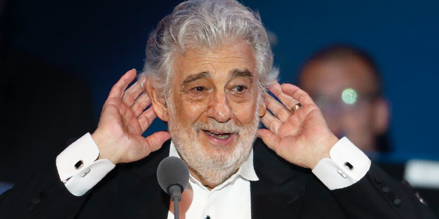 Placido Domingo listens to applause at the end of a concert in Szeged, Hungary, Wednesday, Aug. 28, 2019.