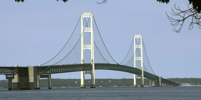 This July 19, 2002 file photo shows the Mackinac Bridge spanning the Strait of Mackinac from Mackinaw City, Michigan.  Enbridge operates a section of Line 5 on the bottom of Michigan's Strait of Mackinac.  