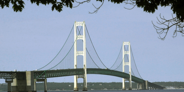 This July 19, 2002, file photo, shows the Mackinac Bridge that spans the Straits of Mackinac from Mackinaw City, Mich. Enbridge runs a section of the Line 5 pipeline on the floor of the Michigan's Straits of Mackinac.  