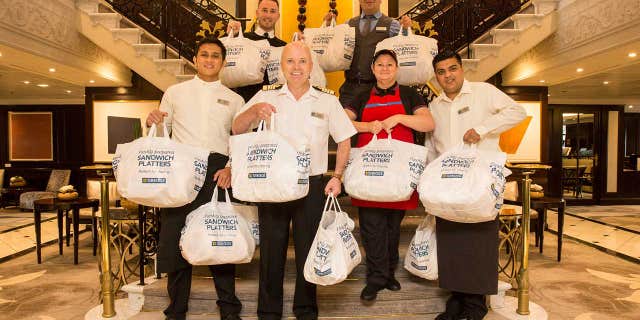Captain Johannes Tysse, center, said the crew from the U.K. convinced him the trip "wouldn’t be complete without a taste" of the local bakery chain.