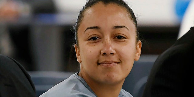 In this May 23, 2018, image, Cyntoia Brown smiles at family members during a clemency hearing in Nashville. (Lacy Atkins/The Tennessean via AP, Pool, File)