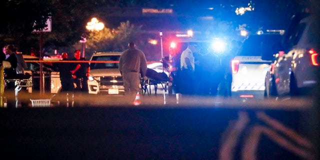 Bodies are removed from at the scene of a mass shooting, Sunday, Aug. 4, 2019, in Dayton, Ohio.