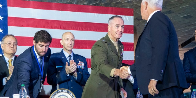 General Joe Dunford, President of the Marine Corps, greets Vice President Mike Pence at the sixth meeting of the National Council of Space. (DOD Photo by US Navy Master Dominique A. Pineiro)