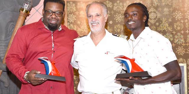 Kashief Hamilton (left) and Randolph Donovan (right) were honored for their heroic efforts in a ceremony on the Carnival Fascination in St. Thomas.