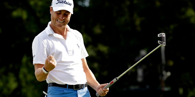 Justin Thomas celebrates after making a birdie on the 18th green during the final round at the BMW Championship golf tournament at Medinah Country Club, Sunday, Aug. 18, 2019, in Medinah, Ill. (AP Photo/Nam Y. Huh)