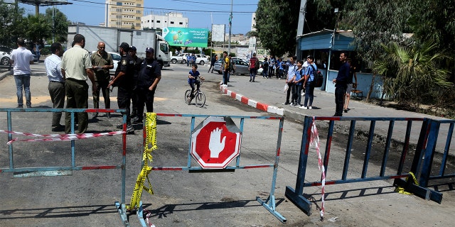 Security forces loyal to Hamas checking the scene following an explosion in Gaza City.