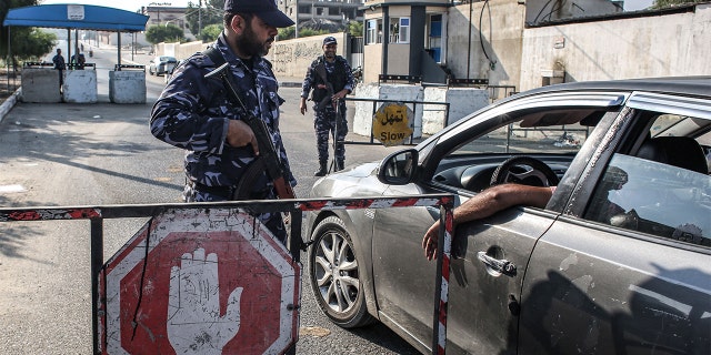 Security forces loyal to Hamas stopping a vehicle at a checkpoint in Khan Yunis in the southern Gaza Strip on Wednesday.
