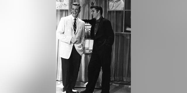 American singer Elvis Presley with presenter Wink Martindale (left) on Wink's television show "Teenage Dance Party" in Memphis, Tenn., on June 16, 1956. (Photo by Silver Screen Collection/Getty Images)