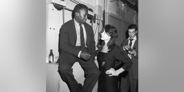 Juliette Greco and Miles Davis are pictured at the club Saint Germain in Paris in 1958.