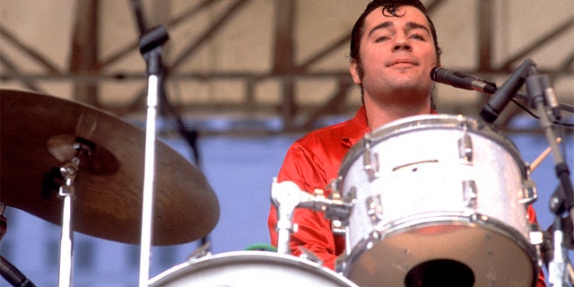 American Rock and Roll musician John 'Jocko' Marcellino, of the group Sha Na Na, performs onstage at Comiskey Park, Chicago, Illinois, August 18, 1979.