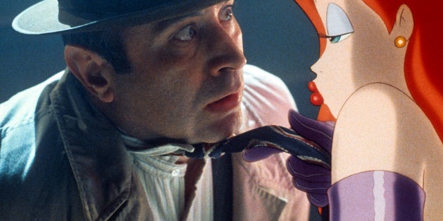 Bob Hoskins is seduced by Jessica Rabbit in a scene from the film 'Who Framed Roger Rabbit', 1988.