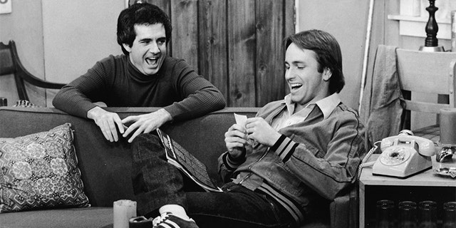 John Ritter and Richard Kline share a laugh in a still from the television series, "Three's Company," circa 1970s. (ABC Television/Courtesy of Getty Images)