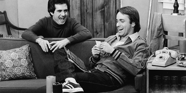 John Ritter and Richard Kline share a laugh in a still from the television series, "Three's Company," circa 1970s. (ABC Television/Courtesy of Getty Images)