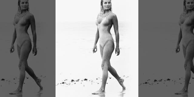 Actress Bo Derek, with her hair in cornrows, walks along the beach in swimwear as Samantha Taylor in the 1979 movie "10," directed by Blake Edwards.