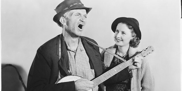 Walter Brennan and Barbara Stanwyck in "Banjo on My Knee." (Photo by John Springer Collection/CORBIS/Corbis via Getty Images)